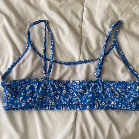 A medium size blue swimsuit with floral design. - Picture 3 of 7